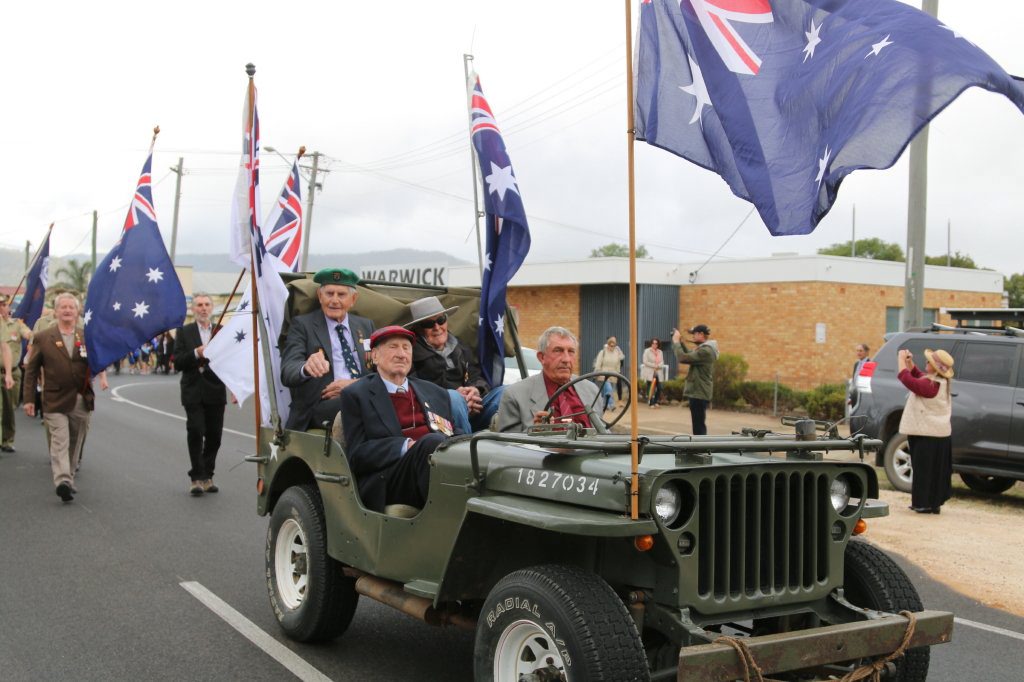 Kevin Lambert drives Veterans, Tom Phillips, Reg Lahiff and John Martin along the Killarney Anzac March route to the Killarney Cenotaph.